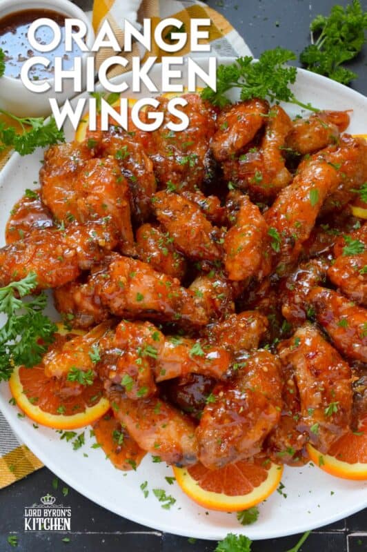 These very sticky wings are prepared with orange marmalade preserves, barbecue sauce, hot sauce, chilies, and seasonings. Orange Chicken Wings are the stickiest and most delicious wings you'll ever eat! They are baked until crispy on the outside and tossed in one of the quickest and easiest sauces! These wings don't need a special occasion; serve these any time you feel like it! #orange #wings #chicken #bbq #sauce #hotsauce