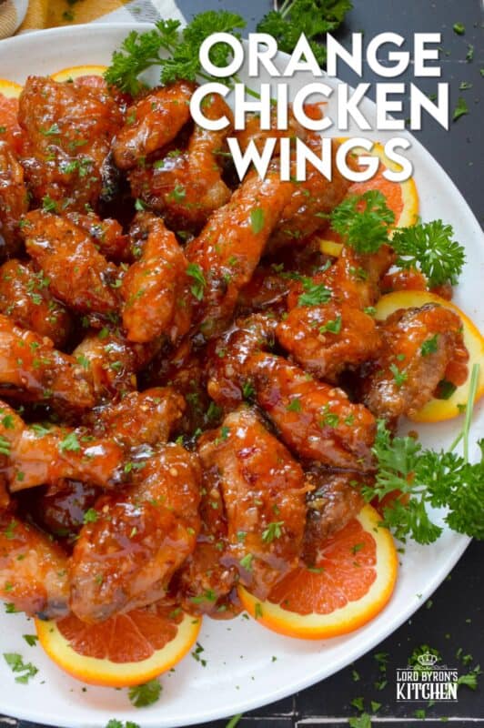 These very sticky wings are prepared with orange marmalade preserves, barbecue sauce, hot sauce, chilies, and seasonings. Orange Chicken Wings are the stickiest and most delicious wings you'll ever eat! They are baked until crispy on the outside and tossed in one of the quickest and easiest sauces! These wings don't need a special occasion; serve these any time you feel like it! #orange #wings #chicken #bbq #sauce #hotsauce