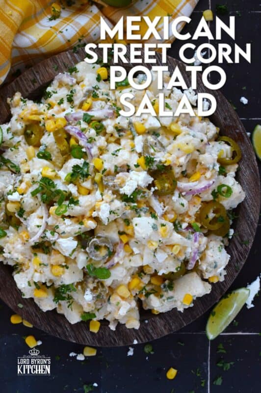 Chopped potatoes are tossed with sweet corn, spicy jalapenos, boiled eggs, fresh green and red onions, and salty cotija cheese to create this most delicious Mexican Street Corn Potato Salad! With its creamy, zingy, and tart dressing, this potato salad will most definitely be the most popular side at any backyard barbecue this summer! #salad #potato #streetcorn #mexican #cotija