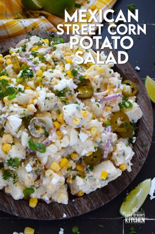 Chopped potatoes are tossed with sweet corn, spicy jalapenos, boiled eggs, fresh green and red onions, and salty cotija cheese to create this most delicious Mexican Street Corn Potato Salad! With its creamy, zingy, and tart dressing, this potato salad will most definitely be the most popular side at any backyard barbecue this summer! #salad #potato #streetcorn #mexican #cotija