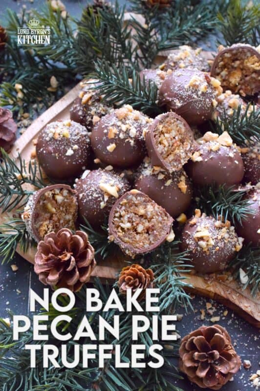 Phenomenal is the only word to describe these No Bake Pecan Pie Truffles! In just a few minutes, the filling is easily prepared and can be made in advance.  Roll the filling into balls and dip them into silky smooth melted milk chocolate.  Top these truffles with more chopped pecans and enjoy! #pecan #balls #truffles #holiday #chocolate #nobake