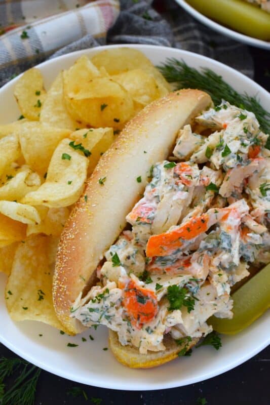 Loaded with crab meat, these Crab Salad Rolls are a fast and easy meal that is easily completed with a handful of really crispy kettle chips!  The crab meat is tossed in a savoury thick dressing made with mayonnaise, chives, dill, lemon, and celery.  It really does not get any easier or any more delicious than this! #crab #imitation #salad #sandwich #rolls