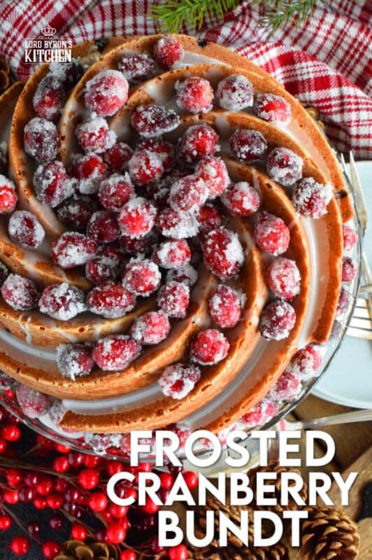 This super easy and beautiful Frosted Cranberry Bundt Cake is loaded with whole, fresh cranberries, frosted with a simple icing, and topped with a sugared cranberry garnish. Tart, sweet, and perfect for any holiday table, this gorgeous, showstopping cake is even more delicious than it looks! #cranberry #bundt #cake #frosted