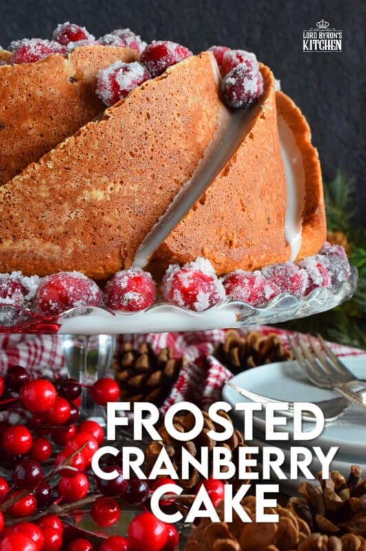 This super easy and beautiful Frosted Cranberry Bundt Cake is loaded with whole, fresh cranberries, frosted with a simple icing, and topped with a sugared cranberry garnish. Tart, sweet, and perfect for any holiday table, this gorgeous, showstopping cake is even more delicious than it looks! #cranberry #bundt #cake #frosted