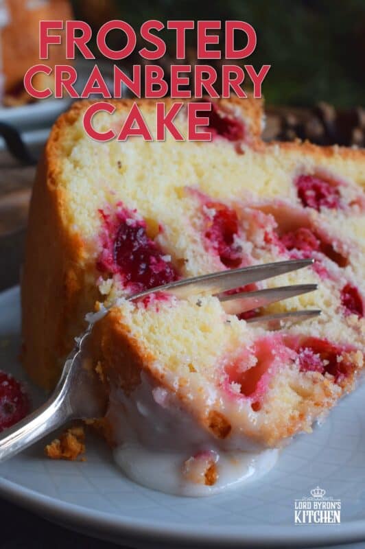This super easy and beautiful Frosted Cranberry Bundt Cake is loaded with whole, fresh cranberries, frosted with a simple icing, and topped with a sugared cranberry garnish. Tart, sweet, and perfect for any holiday table, this gorgeous, showstopping cake is even more delicious than it looks! #cranberry #bundt #cake #frosted