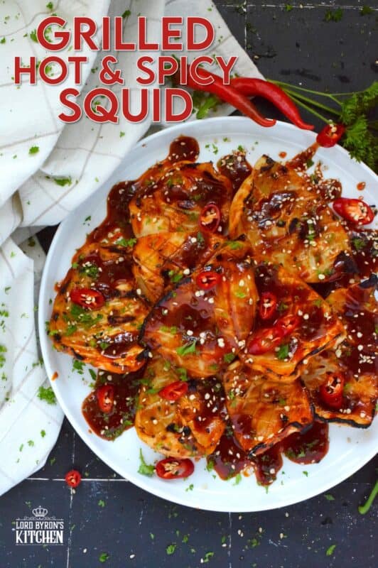 Any excuse to grill is a good excuse! This recipe makes use of a homemade sauce consisting of garlic, ginger, soy sauce, red chilies, and hot sauce. Grilled Hot and Spicy Squid is quick and easy; the squid is super tender with a few char marks. Use freshly prepared squid or frozen squid tubes here! #squid #grilled #hot #spicy #calamari #tubes