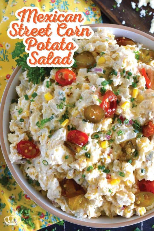 Chopped potatoes are tossed with sweet corn, spicy jalapenos, boiled eggs, fresh green and red onions, and salty cotija cheese to create this most delicious Mexican Street Corn Potato Salad! With its creamy, zingy, and tart dressing, this potato salad will most definitely be the most popular side at any backyard barbecue this summer! #salad #potato #streetcorn #mexican #cotija