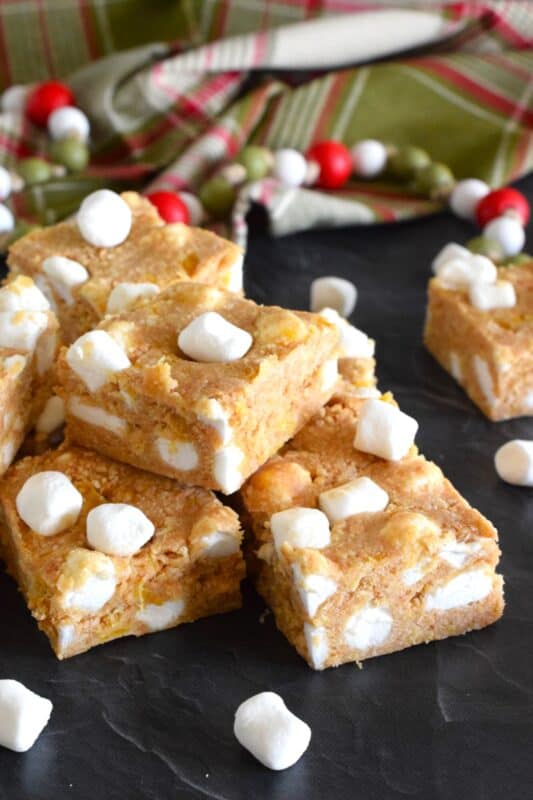 This no-bake recipe requires only four ingredients and about ten minutes of your time. Pineapple Marshmallow Squares are soft, moist, and chewy. They are great for freezing and can be prepared weeks or even months in advance! Optionally, add a splash of rum for a Christmas in the tropics flair! #pineapple #arrowroot #squares #bars #nobake