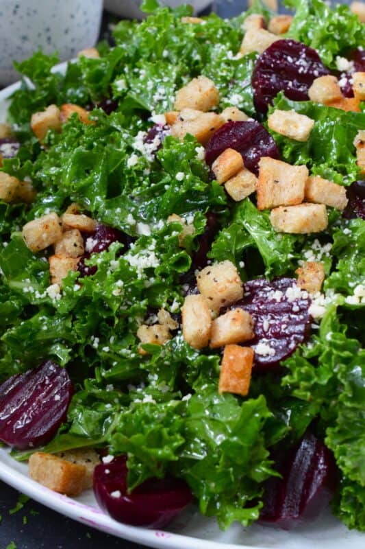This salad is for my fellow beet lovers! Roasted Beet and Kale Salad is purposely made with very few ingredients so that the flavour of the beets is not masked. Roasted beets are tossed with crunchy, chopped kale, grated asiago cheese, croutons, and a lemon-based vinaigrette. #kale #beets #roasted #salad