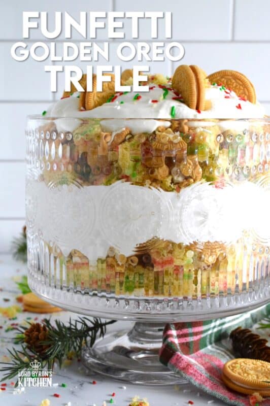 Starting with a homemade vanilla funfetti cake, this Funfetti Golden Oreo Trifle is layered with light and fluffy whipped cream, festive sprinkles, and crushed Oreo cookies. Put a smile on everyone's face with this deliciously gorgeous and easy Christmas dessert! #trifle #oreo #funfetti #sprinkles