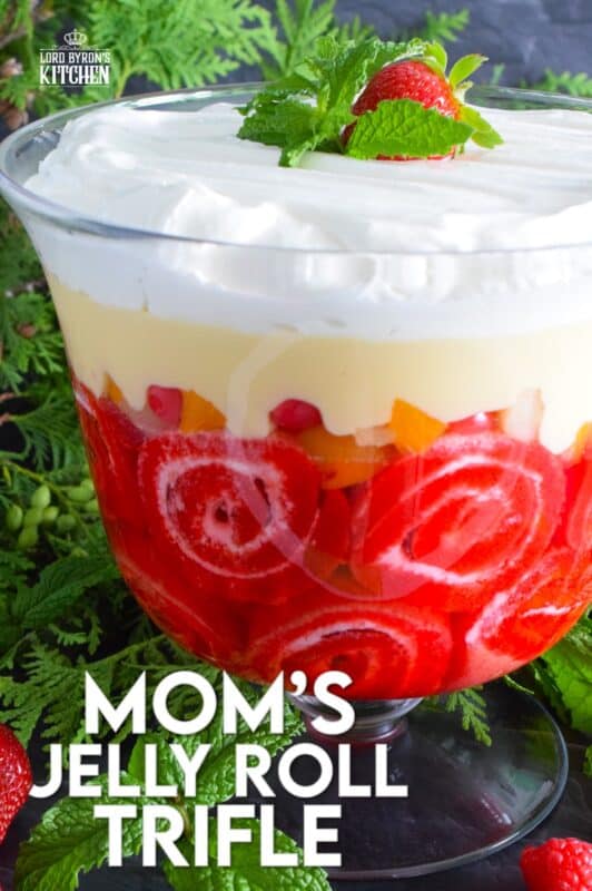 Mom's Jelly Roll Trifle starts with a store-bought raspberry jelly roll that is sliced and layered with raspberry jello, custard, fruit cocktail, and dream whip.  This uncomplicated dessert, with its humble beginnings, is how I remember my mom's deliciously satisfying Sunday trifle. #trifle #cocktail #jellyroll #dessert