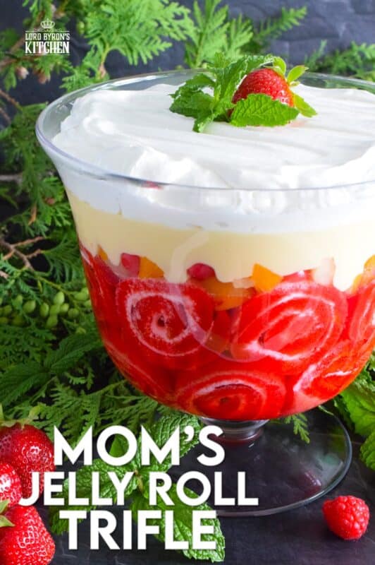 Mom's Jelly Roll Trifle starts with a store-bought raspberry jelly roll that is sliced and layered with raspberry jello, custard, fruit cocktail, and dream whip.  This uncomplicated dessert, with its humble beginnings, is how I remember my mom's deliciously satisfying Sunday trifle. #trifle #cocktail #jellyroll #dessert
