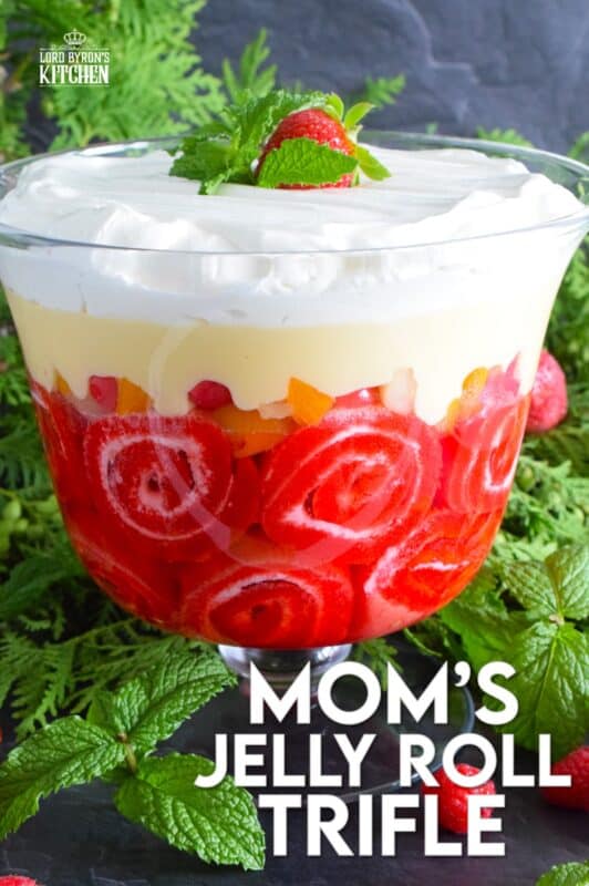 Mom's Jelly Roll Trifle starts with a store-bought raspberry jelly roll that is sliced and layered with raspberry jello, custard, fruit cocktail, and dream whip.  This uncomplicated dessert, with its humble beginnings, is how I remember my mom's deliciously satisfying Sunday trifle. #trifle #cocktail #jellyroll #dessert