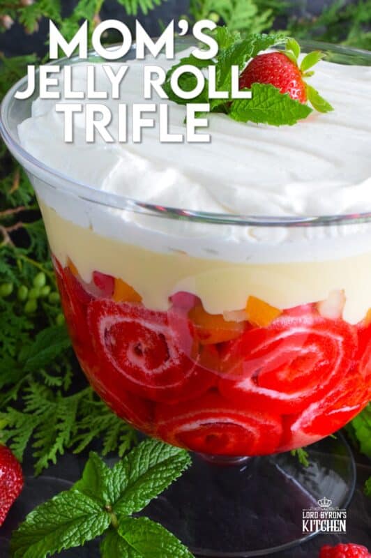 Mom's Jelly Roll Trifle starts with a store-bought raspberry jelly roll that is sliced and layered with raspberry jello, custard, fruit cocktail, and dream whip.  This uncomplicated dessert, with its humble beginnings, is how I remember my mom's deliciously satisfying Sunday trifle. #trifle #cocktail #jellyroll #dessert