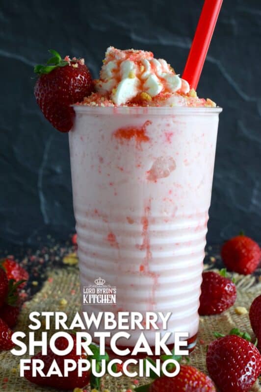 A frappuccino from Starbucks is one of my guilty pleasures, however, the rising cost of such pleasures has me learning how to make them at home for a fraction of the cost. This Strawberry Shortcake Frappuccino is prepared with homemade strawberry shortcake crumbs, milk, ice, vanilla extract, strawberry syrup, and whipped cream. It's even more delicious than it looks! #strawberry #shortcake #frappuccino #summer #frosty
