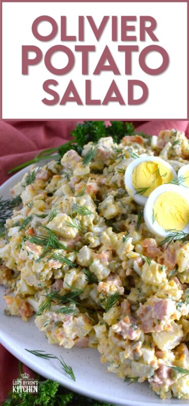 This salad might be more popular in Europe, but there is no reason why anyone shouldn't get to enjoy this creamy, delicous salad.  Olivier Potato Salad is very hearty; prepared with eggs, ham, carrots, and pickles, this salad is full of robust flavour! Serve as a side, or even as a course if preparing for a fancy dinner! #olivier #olivye #potato #salad #ham #russian