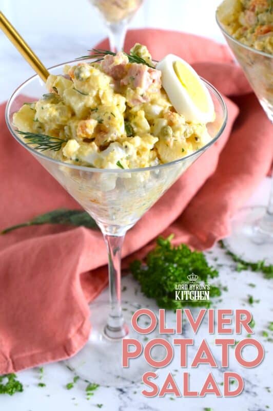 This salad might be more popular in Europe, but there is no reason why anyone shouldn't get to enjoy this creamy, delicous salad.  Olivier Potato Salad is very hearty; prepared with eggs, ham, carrots, and pickles, this salad is full of robust flavour! Serve as a side, or even as a course if preparing for a fancy dinner! #olivier #olivye #potato #salad #ham #russian