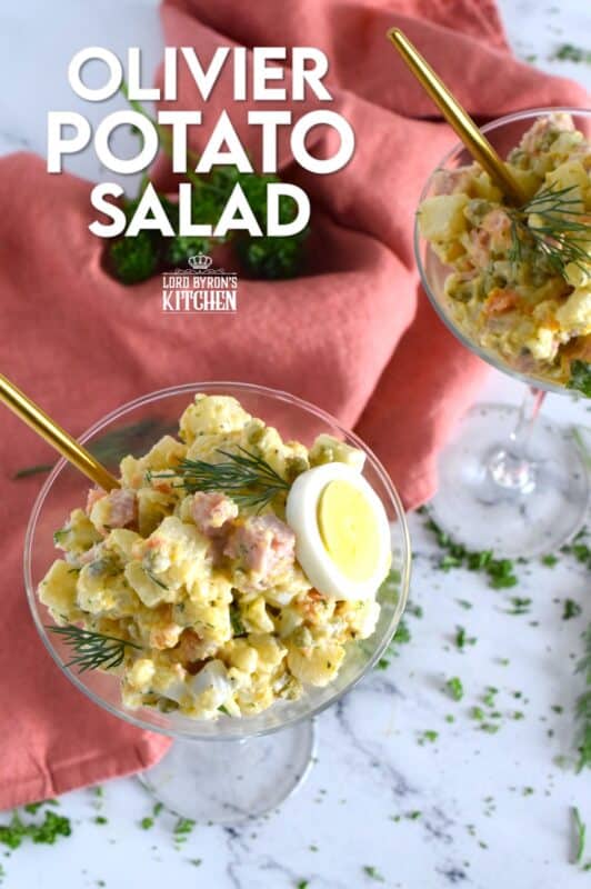 This salad might be more popular in Europe, but there is no reason why anyone shouldn't get to enjoy this creamy, delicous salad.  Olivier Potato Salad is very hearty; prepared with eggs, ham, carrots, and pickles, this salad is full of robust flavour! Serve as a side, or even as a course if preparing for a fancy dinner! #olivier #olivye #potato #salad #ham #russian