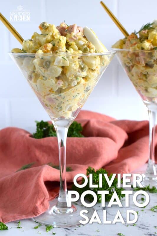 This salad might be more popular in Europe, but there is no reason why anyone shouldn't get to enjoy this creamy, delicous salad.  Olivier Potato Salad is very hearty; prepared with eggs, ham, carrots, and pickles, this salad is full of robust flavour! Serve as a side, or even as a course if preparing for a fancy dinner! #olivier #olivye #potato #salad #ham #russian
