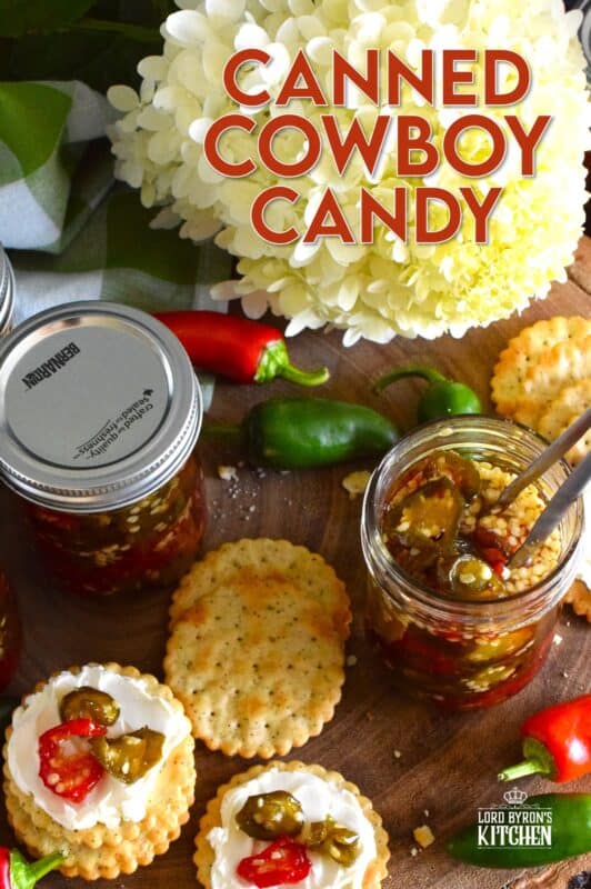 There are several types of canned jalapeno recipes that use up my summer jalapeno harvest, but Canned Cowboy Candy is my favourite! The jalapenos are boiled in a thick syrupy brine to draw out much of the moisture which results in a slighty chewy, sweet and spicy, delicously addicting candy-like treat that tastes great on just about everything! #canned #preserved #jalapeno #jalapenos #cowboy #candy