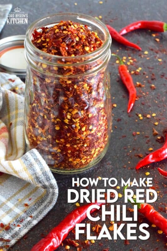 Every summer I harvest an abundance of cayenne peppers from my garden - way too many to eat fresh, so I dry them! Let me tell you how to make dried red chili flakes the easy way - no special equipment needed here; just a baking tray and a warm oven! #cayenne #driedredchili #chiliflakes #chillies #dried #preserve