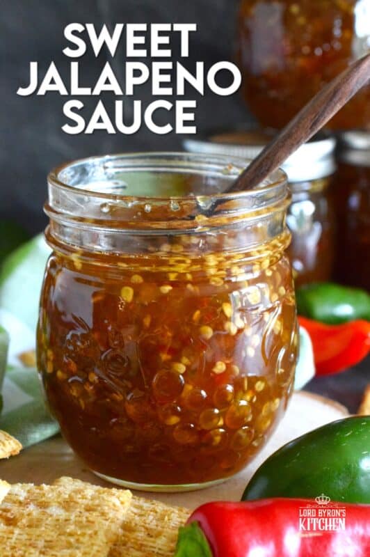 Easy to make using a water bath canning method, this Sweet Jalapeno Sauce can be used as a dip for things like chicken nuggets, used as a spread on baked chicken, pork chops, or even sandwiches. You can pour it generously over baked brie, or stir some into pasta salads. It's also quite delicious on grilled meat and veggies! #jalapeno #hot #sauce #hotsauce #canning #waterbath #peppers