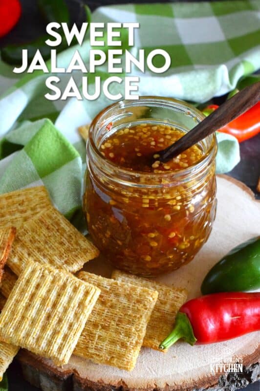 Easy to make using a water bath canning method, this Sweet Jalapeno Sauce can be used as a dip for things like chicken nuggets, used as a spread on baked chicken, pork chops, or even sandwiches. You can pour it generously over baked brie, or stir some into pasta salads. It's also quite delicious on grilled meat and veggies! #jalapeno #hot #sauce #hotsauce #canning #waterbath #peppers