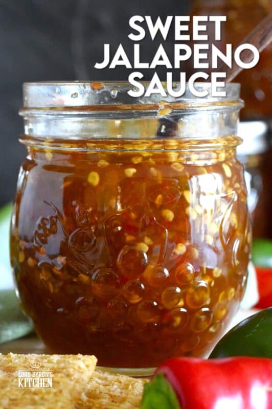 Easy to make using a water bath canning method, this Sweet Jalapeno Sauce can be used as a dip for things like chicken nuggets, used as a spread on baked chicken, pork chops, or even sandwiches. You can pour it generously over baked brie, or stir some into pasta salads. It's also quite delicious on grilled meat and veggies! #jalapeno #hot #sauce #hotsauce #canning #waterbath #peppers