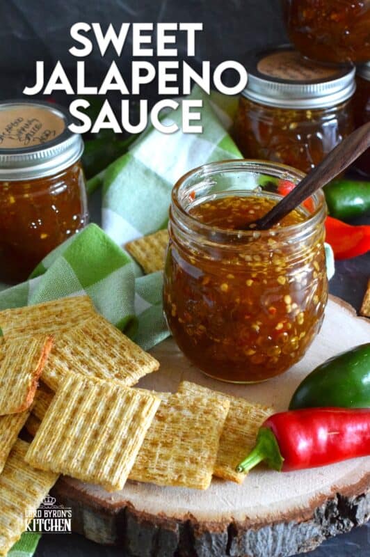 Easy to make using a water bath canning method, this Sweet Jalapeno Sauce can be used as a dip for things like chicken nuggets, used as a spread on baked chicken, pork chops, or even sandwiches. You can pour it generously over baked brie, or stir some into pasta salads. It's also quite delicious on grilled meat and veggies! #jalapeno #hot #sauce #hotsauce #canning #waterbath #peppers