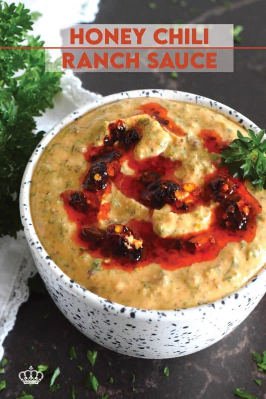 This sauce has it all! First of all, it's quite delicious; it's got heat from some chili crisp oil, coolness from the sour cream, sweetness from a bit of honey, and loads of savoury flavour from an abundance of dried herbs.  Honey Chili Ranch Sauce is great as a dip or a spread! #honey #chili #crisp #oil #sauce