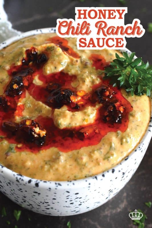 This sauce has it all! First of all, it's quite delicious; it's got heat from some chili crisp oil, coolness from the sour cream, sweetness from a bit of honey, and loads of savoury flavour from an abundance of dried herbs.  Honey Chili Ranch Sauce is great as a dip or a spread! #honey #chili #crisp #oil #sauce