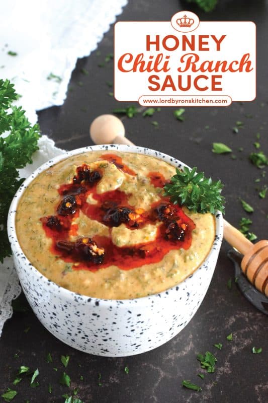 This sauce has it all! First of all, it's quite delicious; it's got heat from some chili crisp oil, coolness from the sour cream, sweetness from a bit of honey, and loads of savoury flavour from an abundance of dried herbs.  Honey Chili Ranch Sauce is great as a dip or a spread! #honey #chili #crisp #oil #sauce