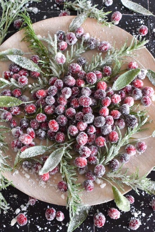 A garnish - no matter how extravagant or simple - can make a recipe look and taste better. Since we eat with our eyes first, one should never skip out on making a dish look better. For the holidays, I often prepare a Sugared Holiday Garnish to make something look extra special! #cranberry #cranberries #rosemary #garnish #sugar #sugared #holidays