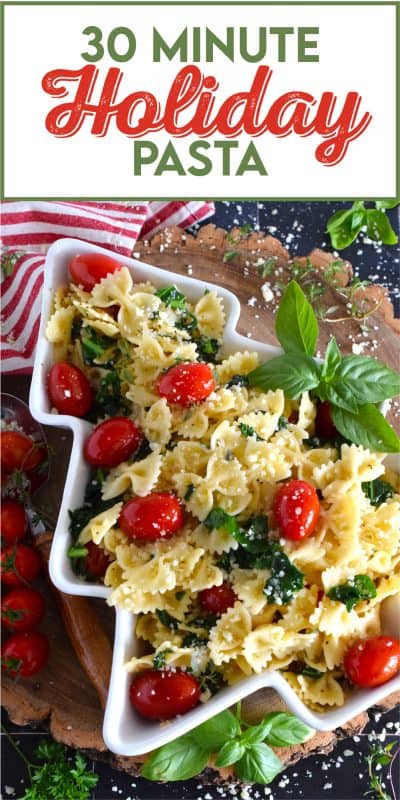 The combination of bright red cherry tomatoes and the forest green colour of sauteed kale come together to make this 30 Minute Holiday Pasta! Perfectly cooked pasta is tossed in a salted butter and garlic sauce with aromatic herbs - simple and delicious! #pasta #holiday #redandgreen #kale #tomatoes