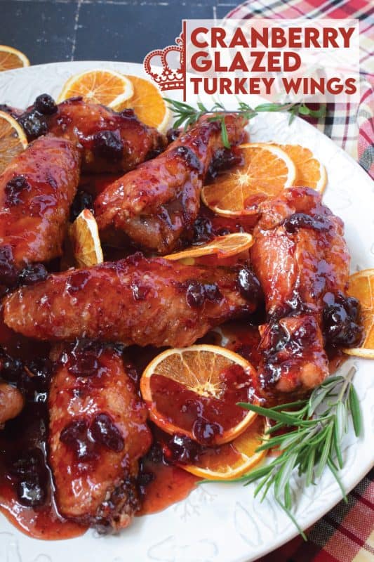 Sometimes roasting a whole turkey for the holidays can be too much, and sometimes, you just need to change things up a little! These Cranberry Glazed Turkey Wings are affordable, easy to prepare, much faster than a whole turkey, and more importantly, smothered in an easy homemade sweet and sticky cranberry sauce! #turkey #wings #cranberry #glazed #sweet #sticky