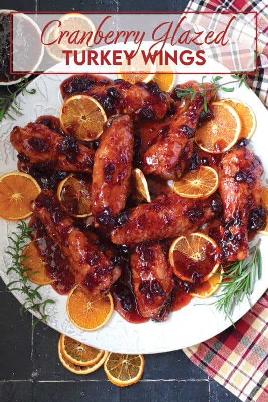Sometimes roasting a whole turkey for the holidays can be too much, and sometimes, you just need to change things up a little! These Cranberry Glazed Turkey Wings are affordable, easy to prepare, much faster than a whole turkey, and more importantly, smothered in an easy homemade sweet and sticky cranberry sauce! #turkey #wings #cranberry #glazed #sweet #sticky