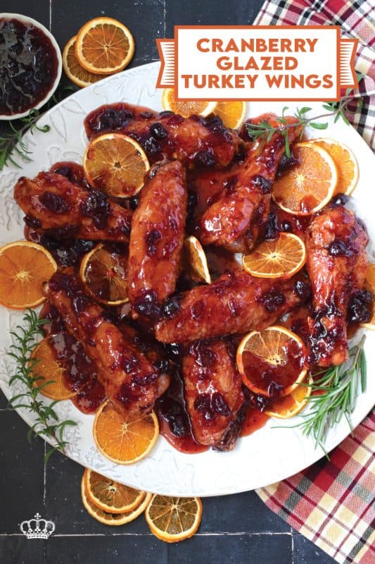 Sometimes roasting a whole turkey for the holidays can be too much, and sometimes, you just need to change things up a little! These Cranberry Glazed Turkey Wings are affordable, easy to prepare, much faster than a whole turkey, and more importantly, smothered in an easy homemade sweet and sticky cranberry sauce! #turkey #wings #cranberry #glazed #sweet #sticky