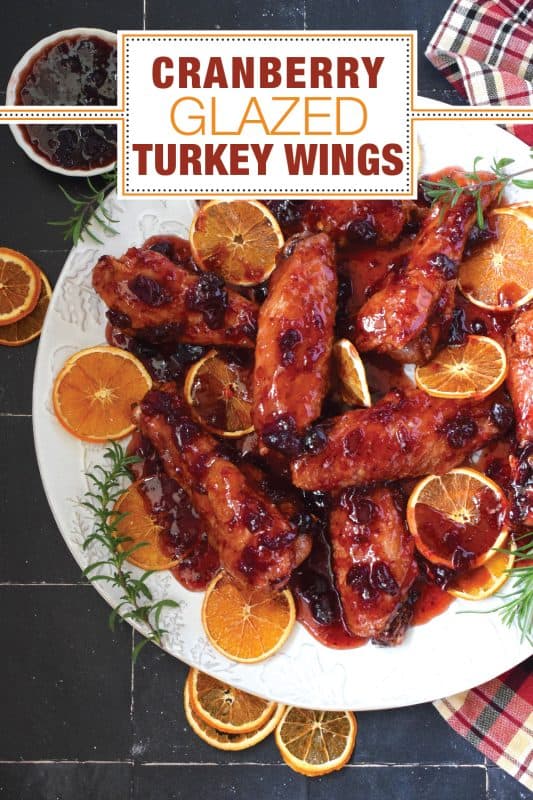 Sometimes roasting a whole turkey for the holidays can be too much, and sometimes, you just need to change things up a little! These Cranberry Glazed Turkey Wings are affordable, easy to prepare, much faster than a whole turkey, and more importantly, smothered in an easy homemade sweet and sticky cranberry sauce! #turkey #wings #cranberry #glazed #sweet #sticky