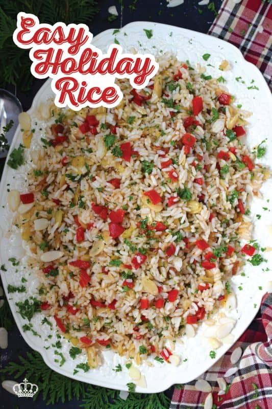 Transform inexpensive plain white rice into the most delicious holiday side dish! Prepared with fresh garlic and ginger, this rice is certainly aromatic.  Tossed with caramelized onions, roasted red peppers, and blanched almonds, Easy Holiday Rice could just become a regular part of your holiday dinners! #rice #leftover #holiday #caramelized #onion #peppers #almonds