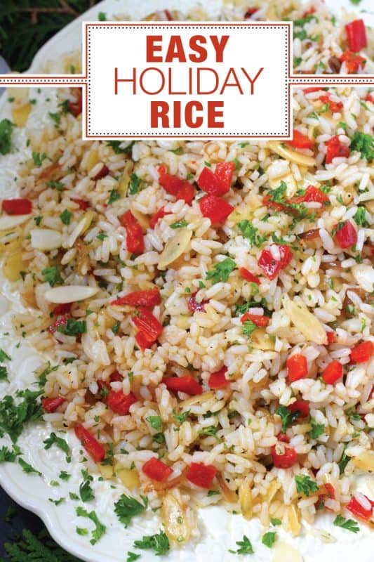 Transform inexpensive plain white rice into the most delicious holiday side dish! Prepared with fresh garlic and ginger, this rice is certainly aromatic.  Tossed with caramelized onions, roasted red peppers, and blanched almonds, Easy Holiday Rice could just become a regular part of your holiday dinners! #rice #leftover #holiday #caramelized #onion #peppers #almonds