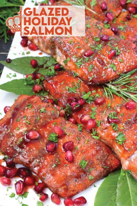 Salmon is often overlooked when it comes to a holiday main, but if you do it right, it can easily replace the overwhelmingly large and daunting task of roasting an entire turkey.  My Glazed Holiday Salmon is smothered with a savoury tart and tangy pomegranate molasses and topped with fresh pomegranate arils! #salmon #holiday #main #seafood #glazed #pomegranate #molasses