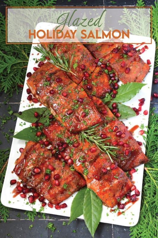 Salmon is often overlooked when it comes to a holiday main, but if you do it right, it can easily replace the overwhelmingly large and daunting task of roasting an entire turkey.  My Glazed Holiday Salmon is smothered with a savoury tart and tangy pomegranate molasses and topped with fresh pomegranate arils! #salmon #holiday #main #seafood #glazed #pomegranate #molasses