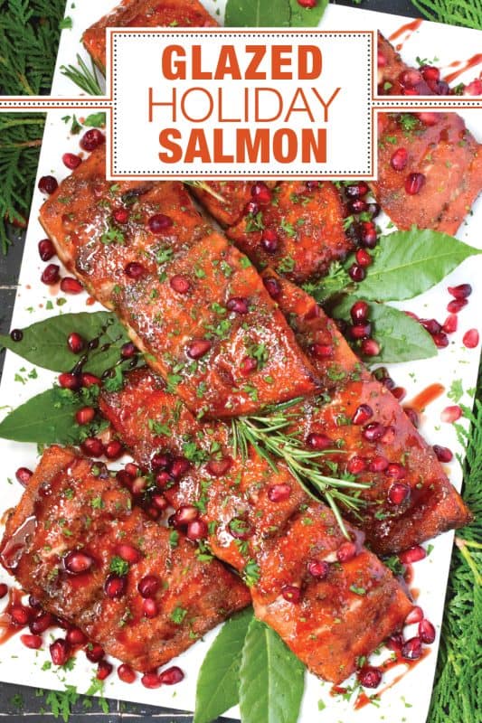 Salmon is often overlooked when it comes to a holiday main, but if you do it right, it can easily replace the overwhelmingly large and daunting task of roasting an entire turkey.  My Glazed Holiday Salmon is smothered with a savoury tart and tangy pomegranate molasses and topped with fresh pomegranate arils! #salmon #holiday #main #seafood #glazed #pomegranate #molasses