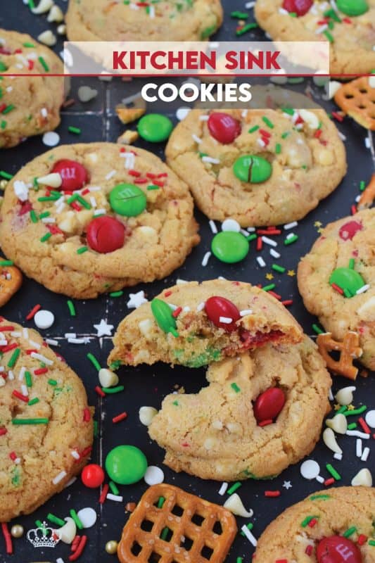 Everything but the kitchen sink is an expression used to describe a recipe with lots of ingredients. My Holiday Kitchen Sink Cookies are prepared with a basic cookie dough, but packed with pretzels, candy, sprinkles, chocolate, and even crushed potato chips! It might sound odd, but these cookies are certainly delicious! #kitchensink #christmas #cookies #M&M