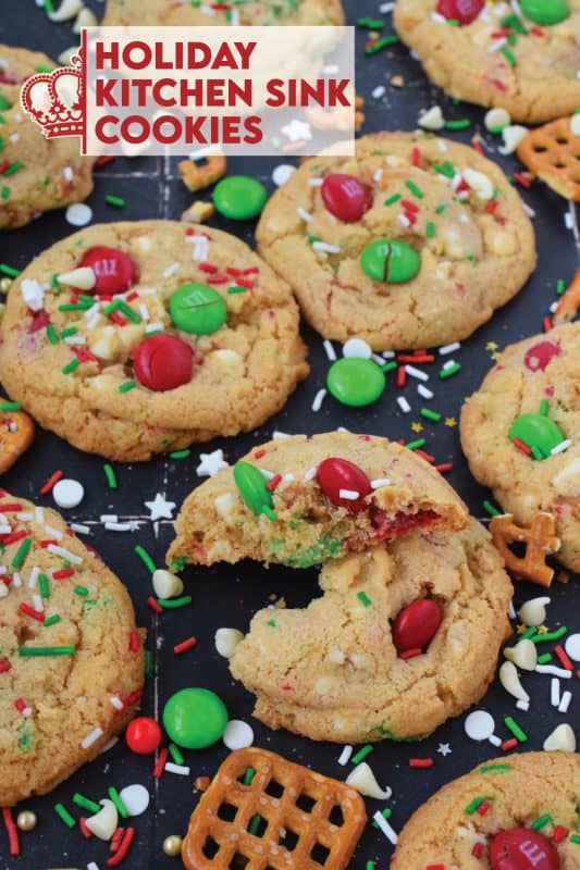 Everything but the kitchen sink is an expression used to describe a recipe with lots of ingredients. My Holiday Kitchen Sink Cookies are prepared with a basic cookie dough, but packed with pretzels, candy, sprinkles, chocolate, and even crushed potato chips! It might sound odd, but these cookies are certainly delicious! #kitchensink #christmas #cookies #M&M