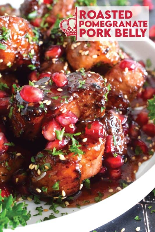 Marinated and flavoured with simple seasonings and sauces found in most kitchens, this Roasted Pomegranate Pork Belly is baked until moist and tender and then tossed in a honey and pomegranate molasses sauce, making this main easy to prepare for the holidays! #roasted #pork #porkbelly #pomegranate #holidays #molasses