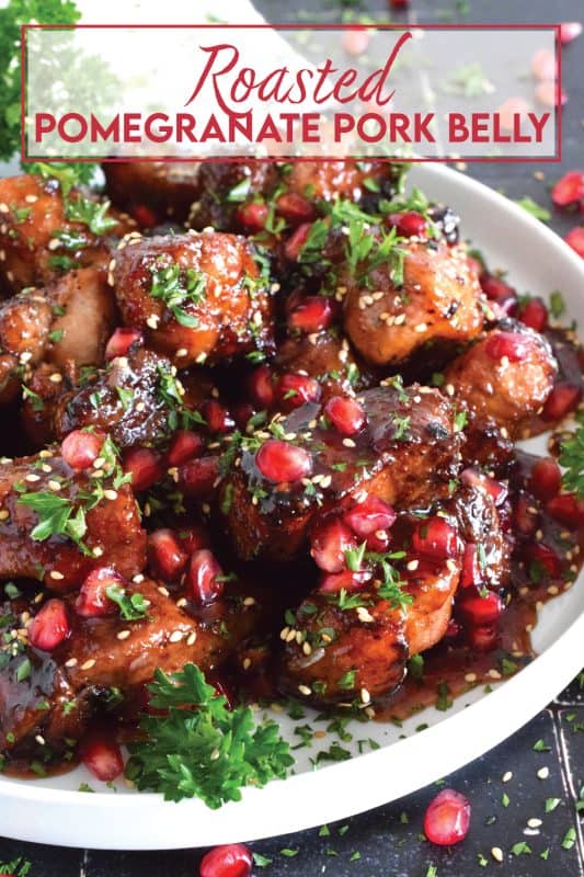 Marinated and flavoured with simple seasonings and sauces found in most kitchens, this Roasted Pomegranate Pork Belly is baked until moist and tender and then tossed in a honey and pomegranate molasses sauce, making this main easy to prepare for the holidays! #roasted #pork #porkbelly #pomegranate #holidays #molasses