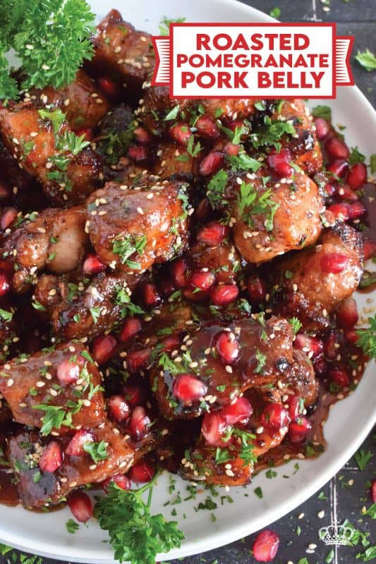 Marinated and flavoured with simple seasonings and sauces found in most kitchens, this Roasted Pomegranate Pork Belly is baked until moist and tender and then tossed in a honey and pomegranate molasses sauce, making this main easy to prepare for the holidays! #roasted #pork #porkbelly #pomegranate #holidays #molasses