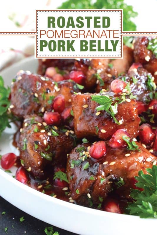 Marinated and flavoured with simple seasonings and sauces found in most kitchens, this Roasted Pomegranate Pork Belly is baked until moist and tender and then tossed in a honey and pomegranate molasses sauce, making this main easy to prepare for the holidays! #roasted #pork #porkbelly #pomegranate #holidays #molasses