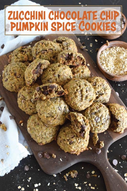 These deliciously soft and chewy cookies are baked with healthy amount of shredded zucchini and rolled oats. Flavoured with a pumpkin spice blend and sweetened with milk chocolate chips, these cookies also have crunch factor with toasted chopped walnuts! #pumpkinspice #zucchini #cookies #chocolate